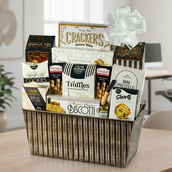 Gourmet gift basket with various snacks and treats in a decorative box.