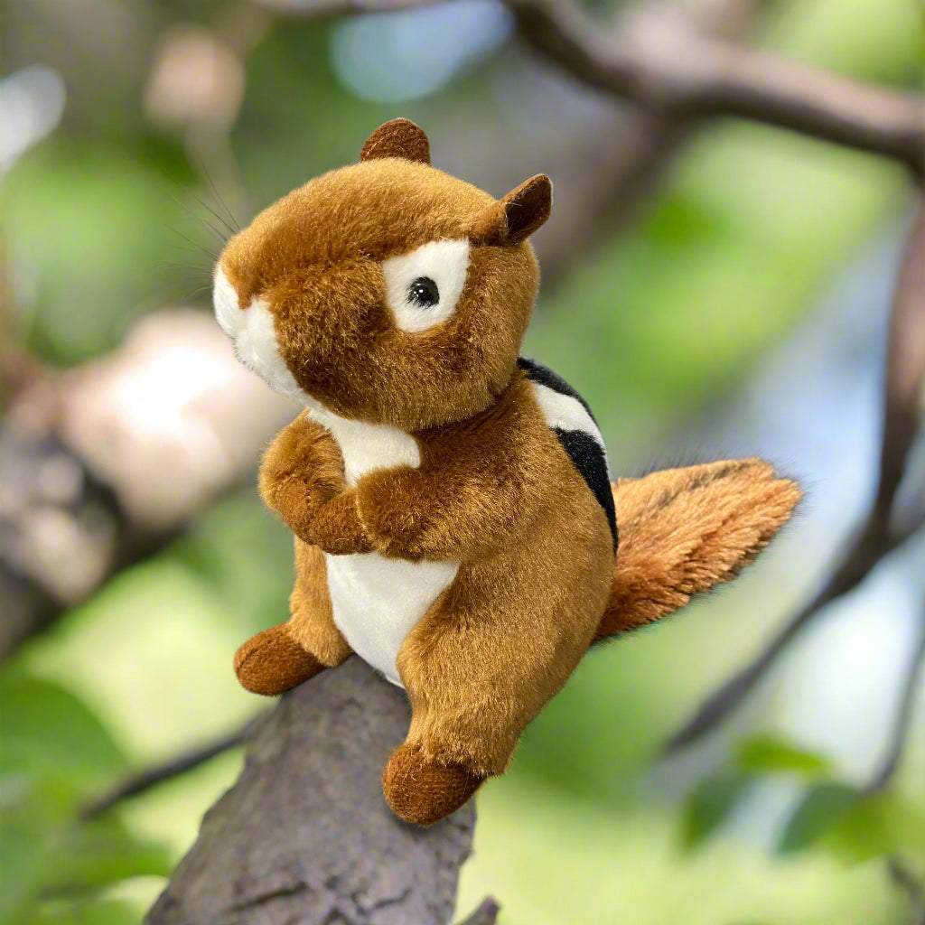 A plush toy of a chipmunk with a brown body, white and black stripes, and a soft texture.