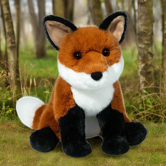 Plush fox toy on a white background