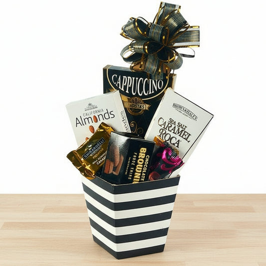 Gift basket with chocolate bars, cookies, and a bow on a white background