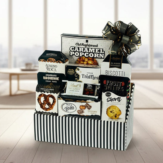 Gourmet gift basket with various snacks and treats on a white background