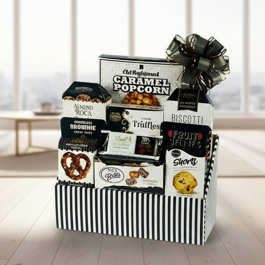 Gourmet gift basket with various snacks and treats on a white background