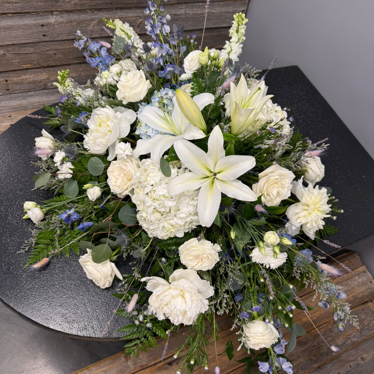 Bouquet of white flowers on a wooden surface